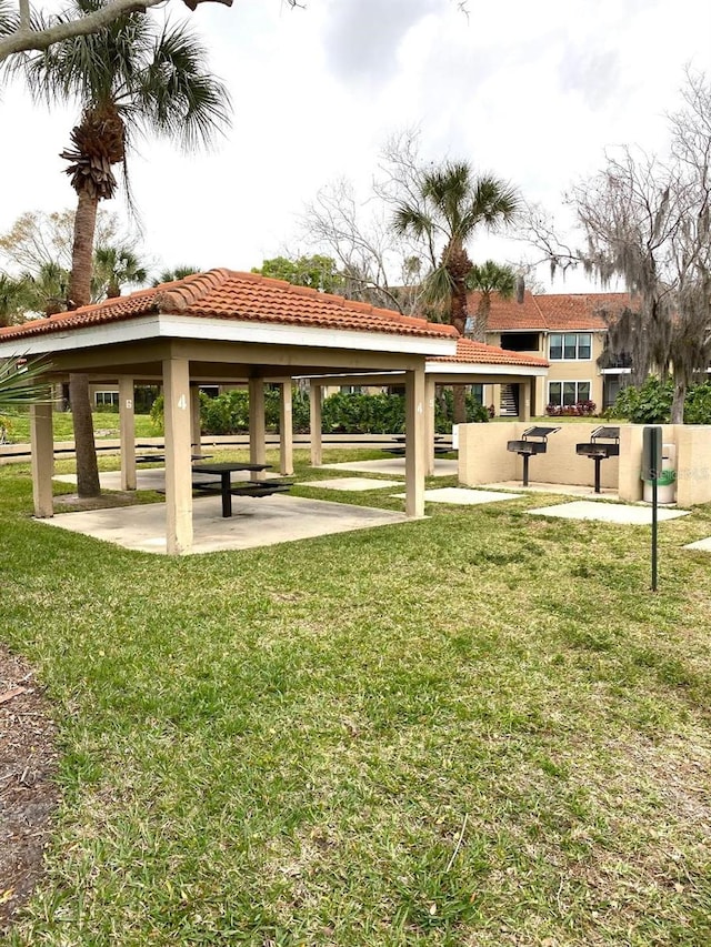 surrounding community with a gazebo and a lawn