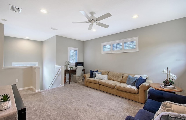 living room with light carpet, baseboards, visible vents, and recessed lighting