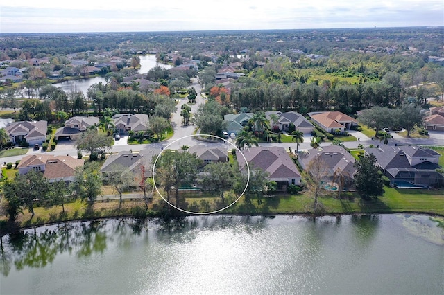 drone / aerial view with a water view and a residential view