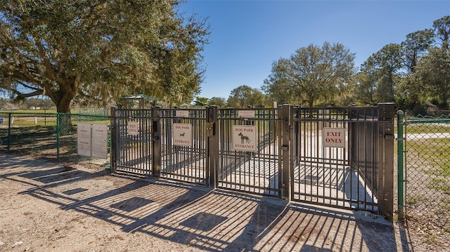 view of gate featuring fence