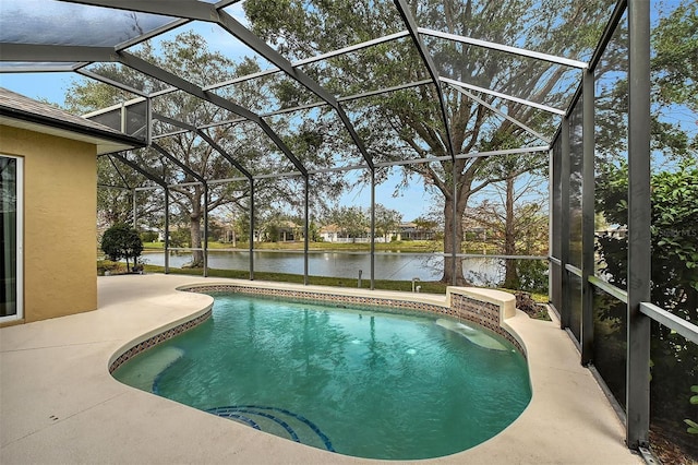 pool with a lanai, a water view, and a patio