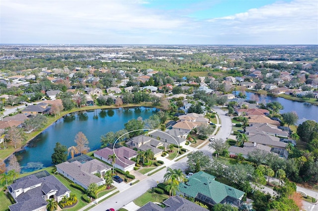 bird's eye view with a water view and a residential view