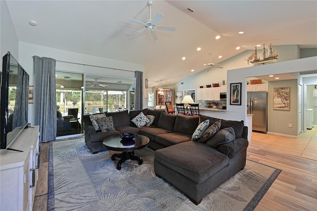 living room featuring light hardwood / wood-style floors and lofted ceiling