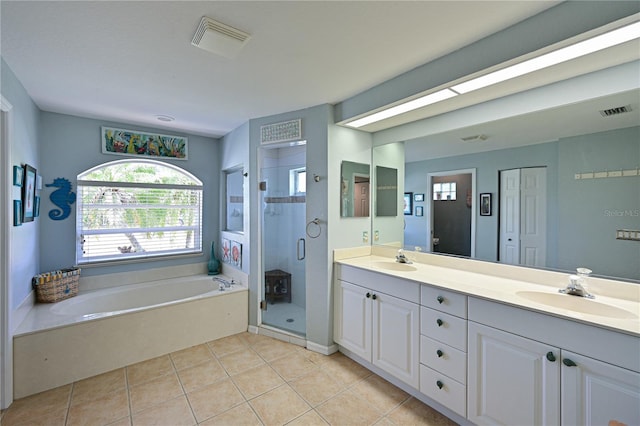 bathroom with tile patterned flooring, vanity, and independent shower and bath