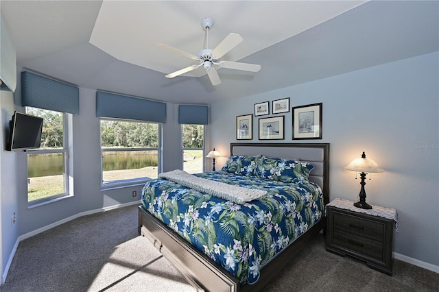 bedroom featuring ceiling fan and dark carpet