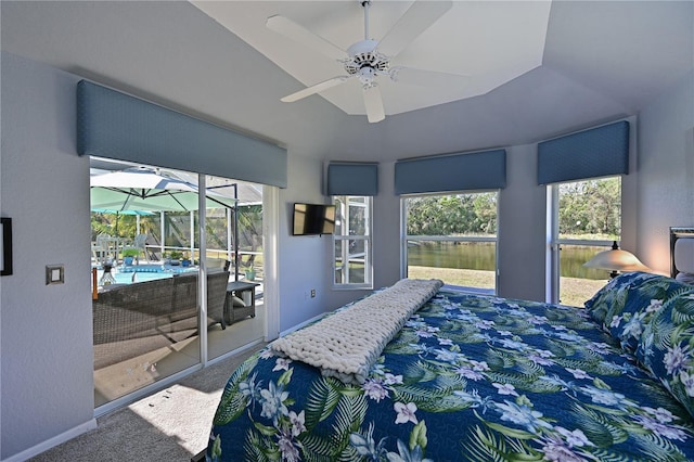 bedroom featuring ceiling fan, access to exterior, carpet floors, and lofted ceiling