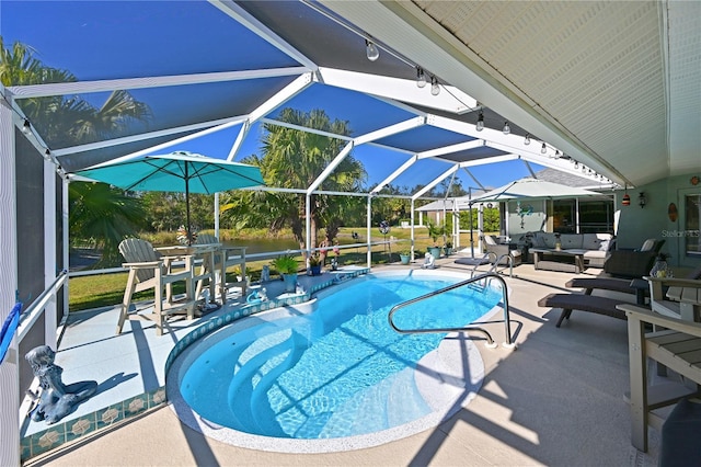 view of pool featuring a lanai, an outdoor living space, and a patio