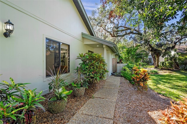 view of home's exterior with a yard