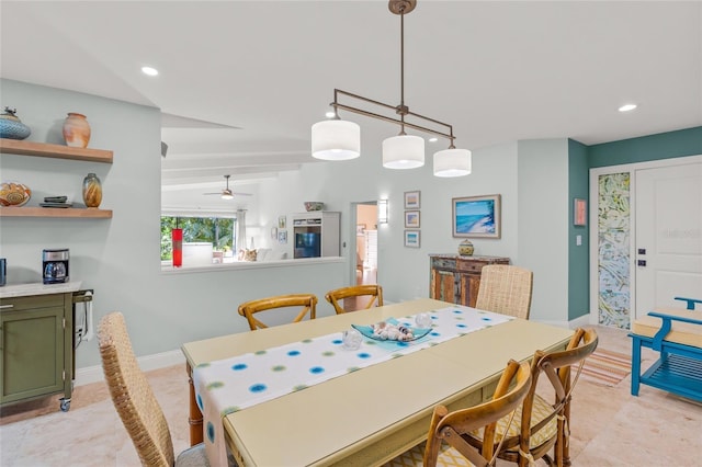 dining room with ceiling fan and vaulted ceiling