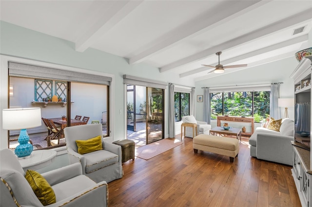 interior space with wood-type flooring, lofted ceiling with beams, and ceiling fan