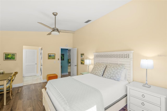 bedroom featuring dark hardwood / wood-style floors, ceiling fan, and lofted ceiling