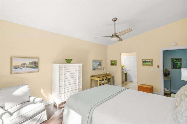 bedroom featuring ceiling fan, wood-type flooring, and lofted ceiling