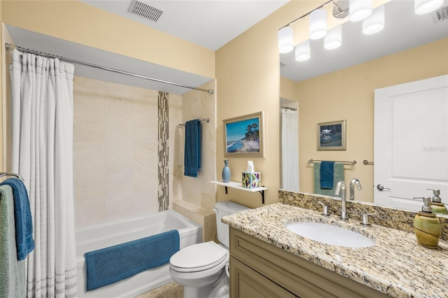 full bathroom with vanity, toilet, and shower / tub combo with curtain