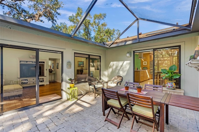 sunroom / solarium featuring vaulted ceiling