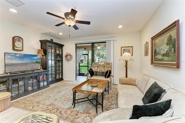 living room featuring ceiling fan