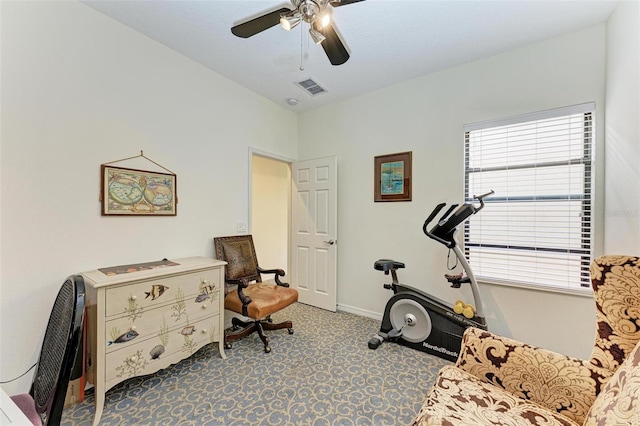 exercise area with carpet floors and ceiling fan