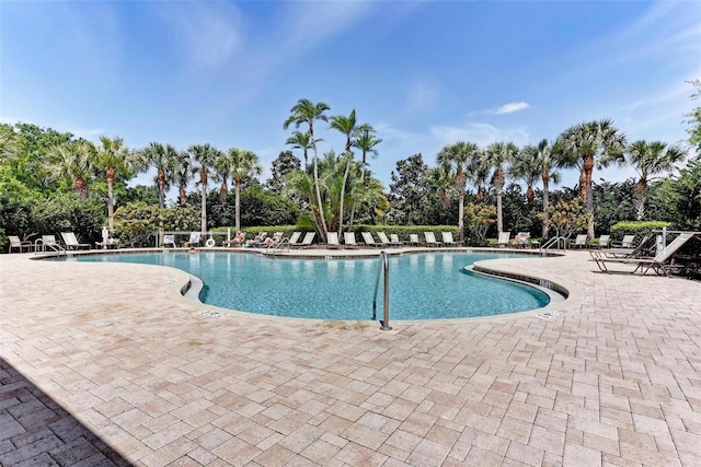 view of swimming pool featuring a patio area