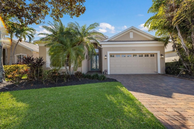 view of front facade with a front lawn and a garage