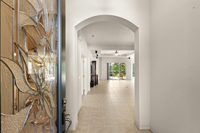 hallway featuring light tile patterned flooring