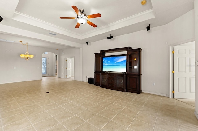 unfurnished living room featuring ceiling fan with notable chandelier, light tile patterned flooring, a raised ceiling, and crown molding