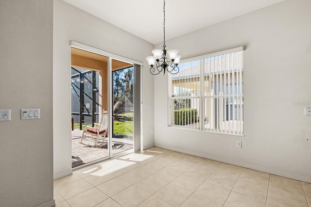 unfurnished dining area with light tile patterned floors and a notable chandelier