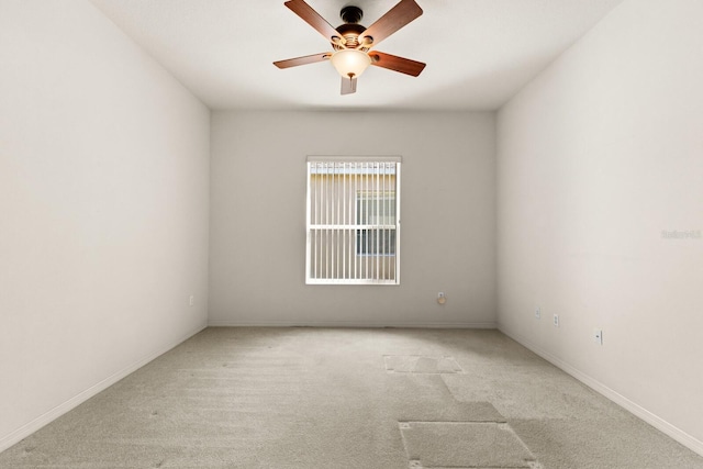 unfurnished room featuring light carpet and ceiling fan