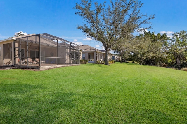 view of yard featuring glass enclosure