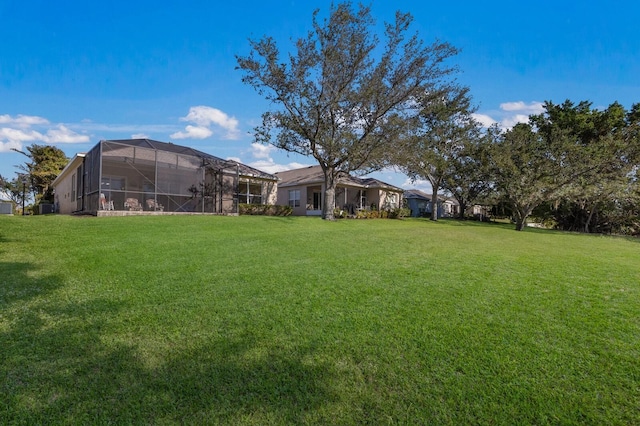 view of yard featuring a lanai