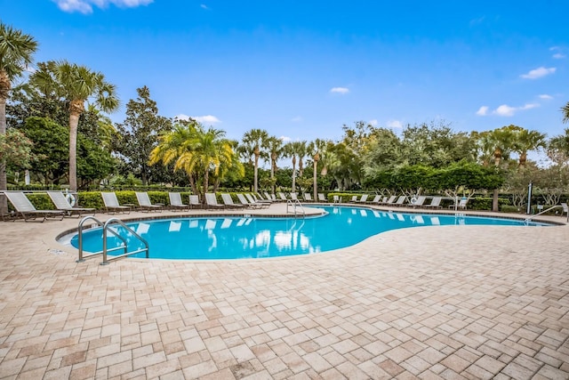 view of swimming pool with a patio