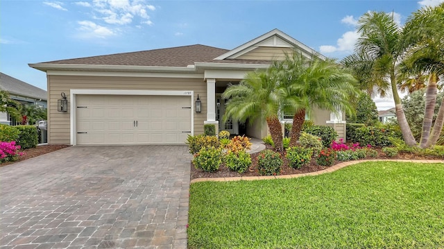 view of front facade with a front lawn and a garage