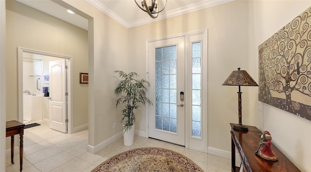 foyer featuring crown molding, light tile patterned floors, and an inviting chandelier