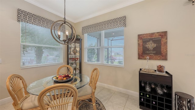 tiled dining space with a notable chandelier and ornamental molding