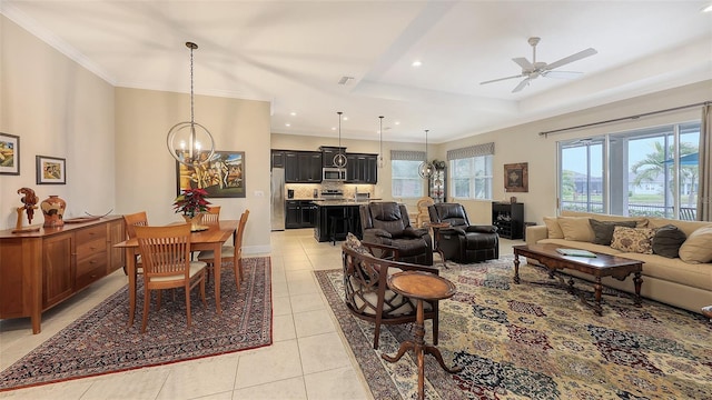 living room with light tile patterned floors, ceiling fan with notable chandelier, and a tray ceiling