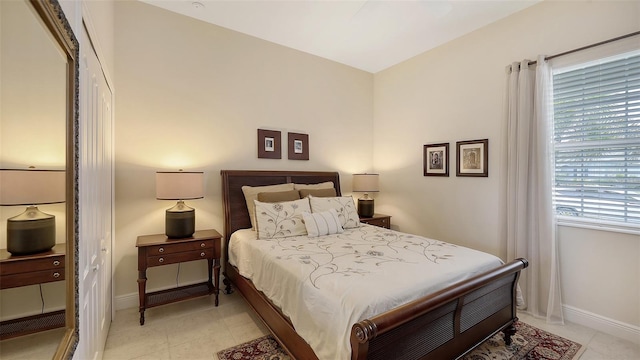 bedroom featuring multiple windows and a closet