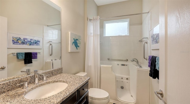 bathroom with vanity, toilet, and curtained shower