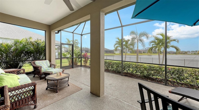 sunroom / solarium featuring ceiling fan