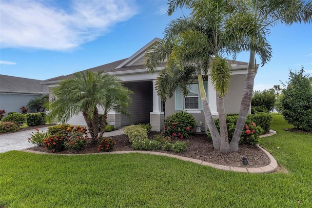 13789 Old Creek Ct, Parrish, FL 34219 - view of front of home with stucco siding, driveway, and a front lawn
