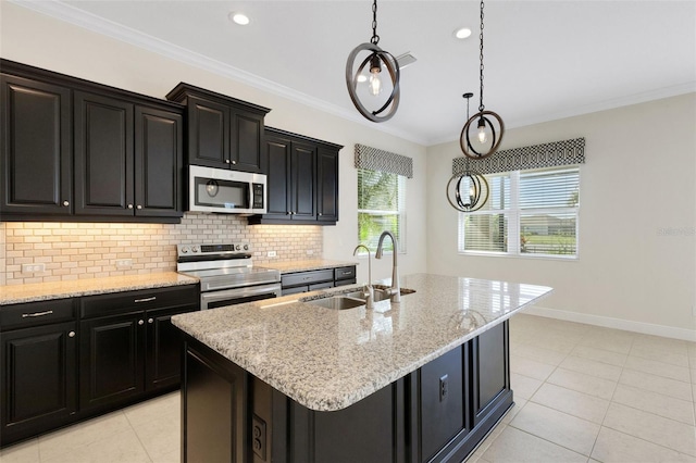 13789 Old Creek Ct, Parrish, FL 34219 - kitchen featuring stainless steel appliances, dark cabinetry, decorative backsplash, light tile patterned floors, and ornamental molding