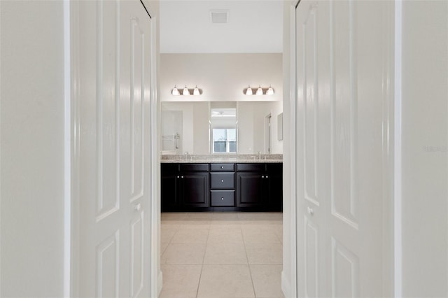 13789 Old Creek Ct, Parrish, FL 34219 - full bathroom with double vanity and tile patterned floors