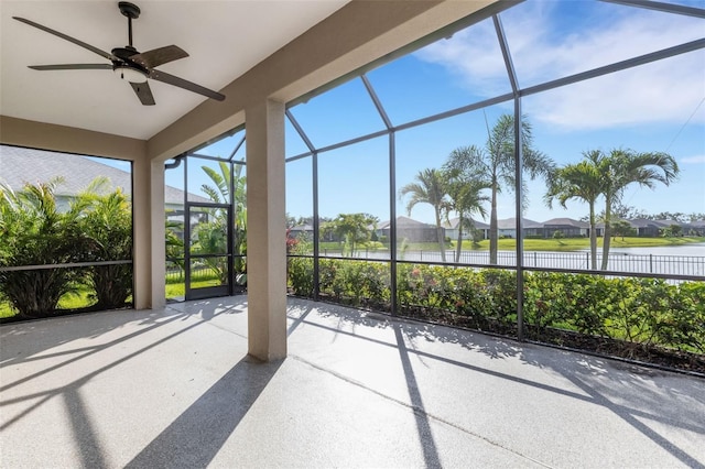 13789 Old Creek Ct, Parrish, FL 34219 - unfurnished sunroom featuring a ceiling fan, a residential view, and a water view