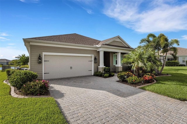13789 Old Creek Ct, Parrish, FL 34219 - single story home with decorative driveway, a front lawn, and an attached garage