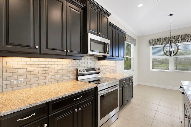 13789 Old Creek Ct, Parrish, FL 34219 - kitchen with appliances with stainless steel finishes, backsplash, a chandelier, ornamental molding, and hanging light fixtures