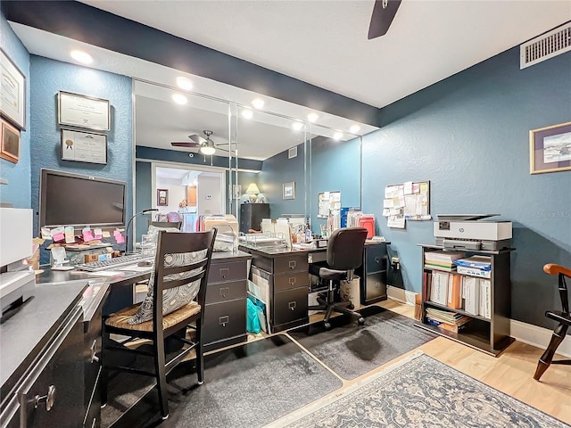 office area with ceiling fan and wood-type flooring