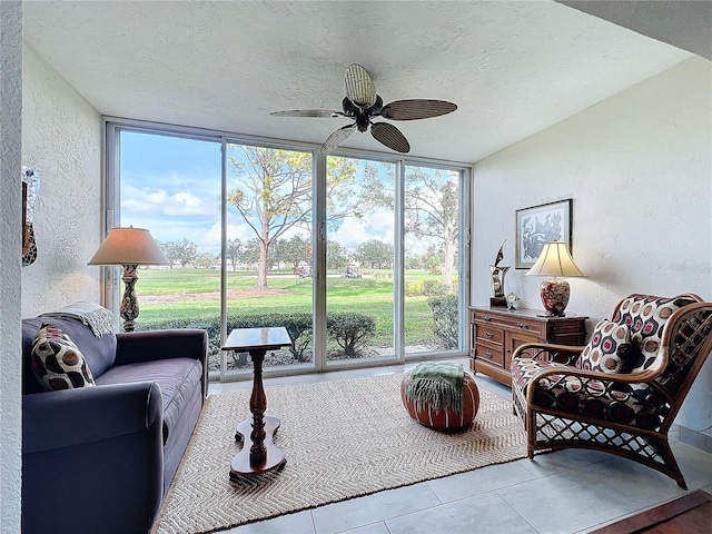 sunroom with ceiling fan