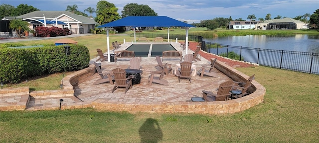 exterior space featuring a water view and a yard