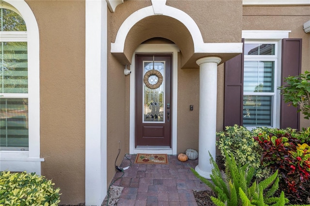 property entrance featuring a wall unit AC