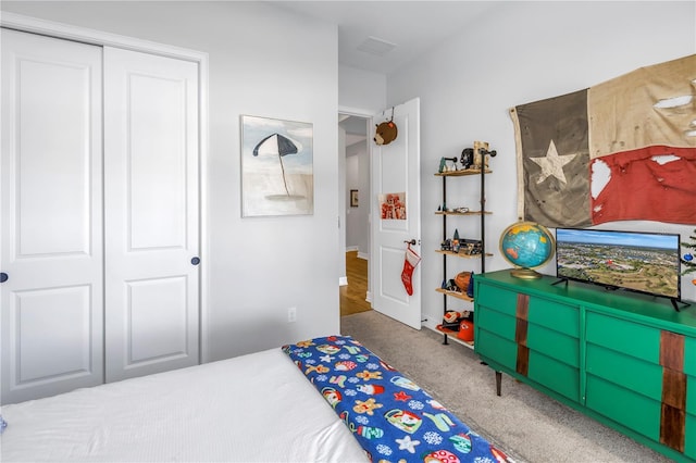 carpeted bedroom with a closet