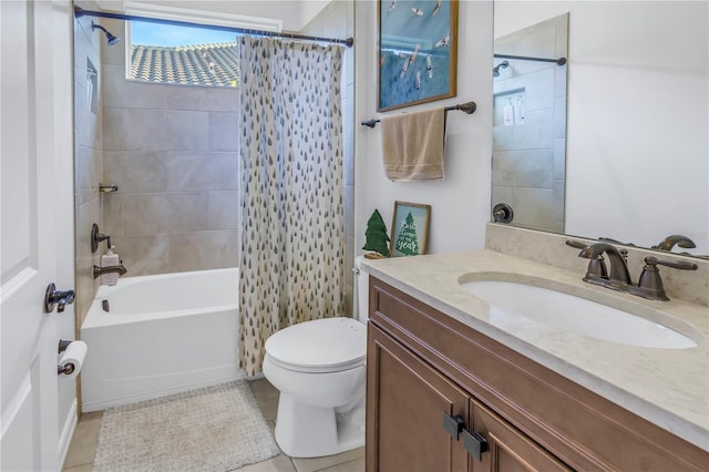 full bathroom featuring tile patterned floors, vanity, toilet, and shower / bath combo with shower curtain