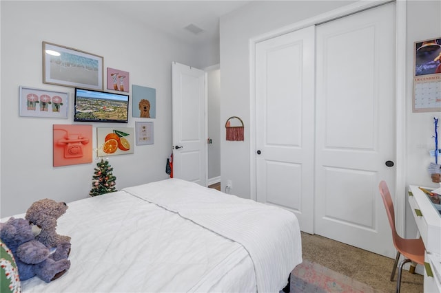 carpeted bedroom with a closet