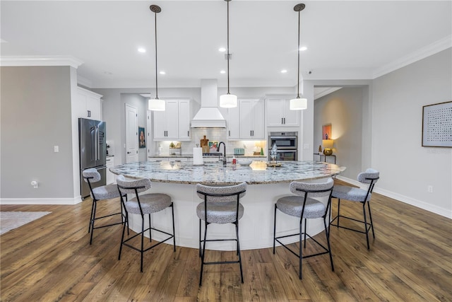 kitchen with white cabinets, custom range hood, dark hardwood / wood-style floors, and pendant lighting